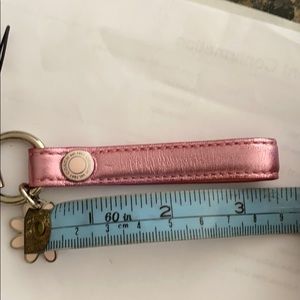 Coach Bags - Coach pink metallic strap with daisy charm Coach Bags - Coach pink metallic strap with daisy charm
